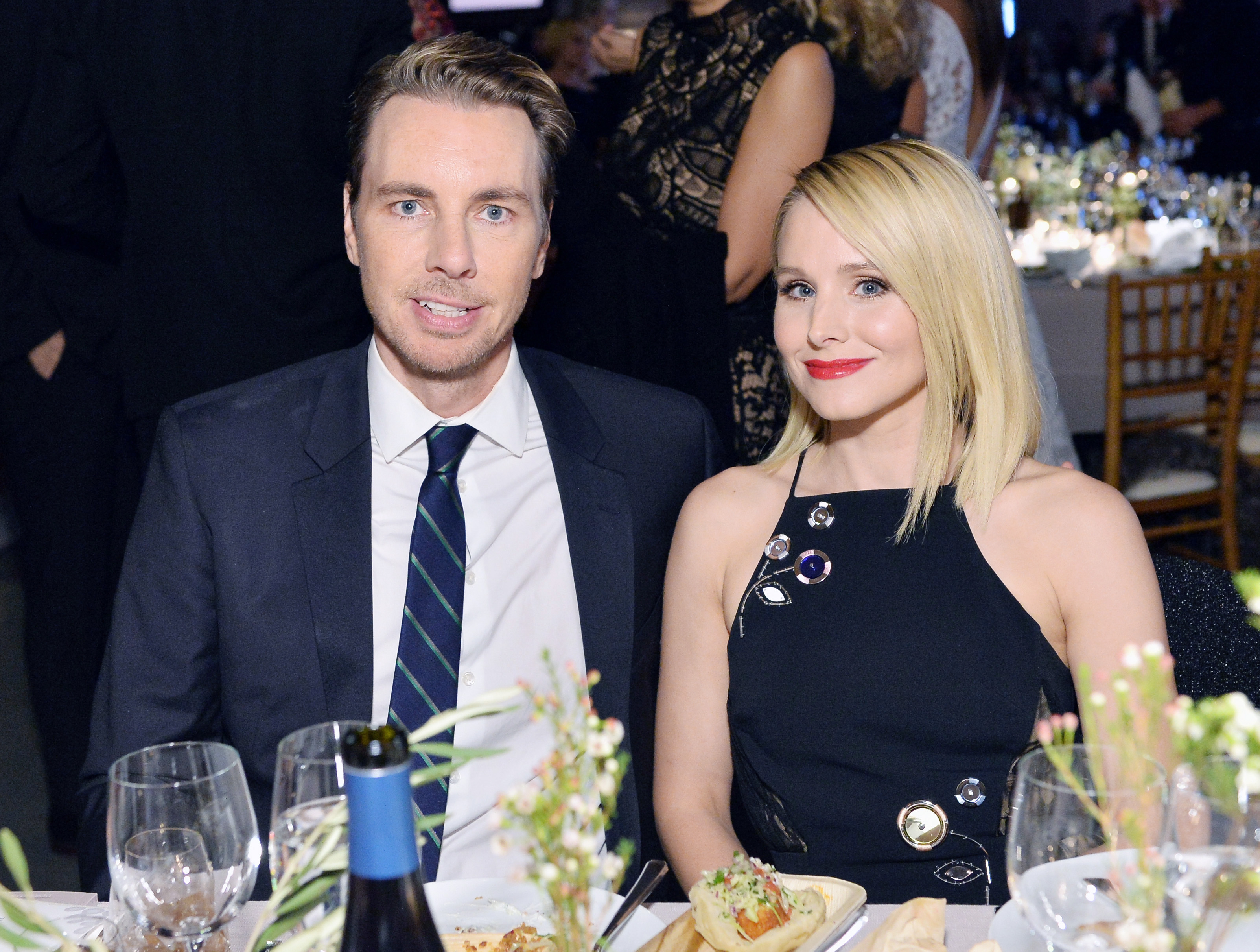 Dax Shepard and Kristen Bell sit down for dinner at an event.