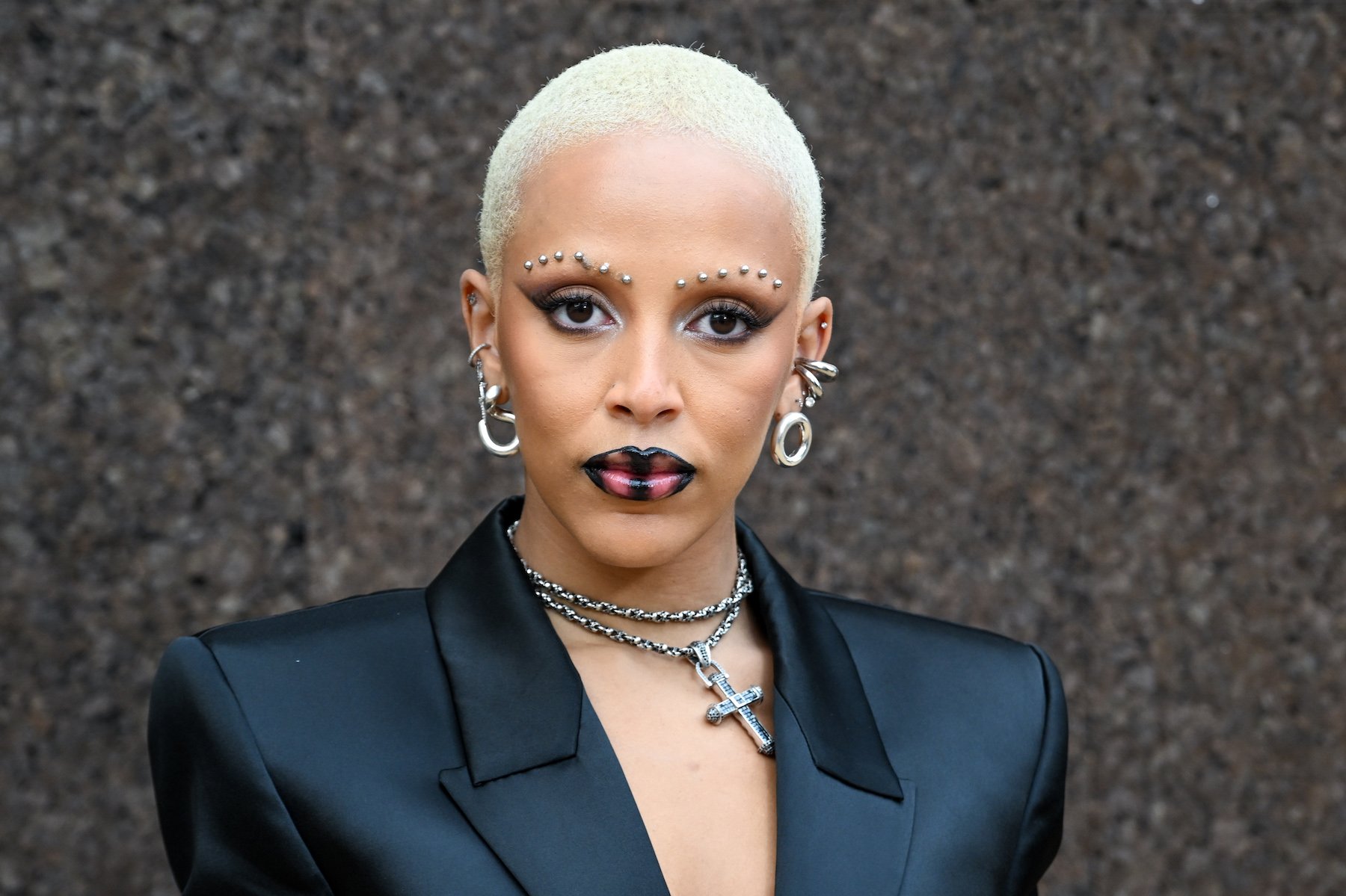 Doja Cat, who was compared to Britney Spears after shaving her head, wearing a black blazer