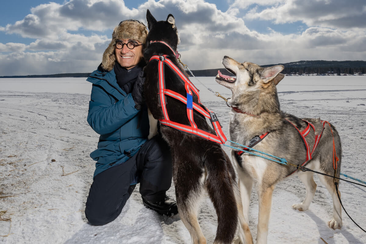 'The Reluctant Traveler': Eugene Levy pets sled dogs in Finland