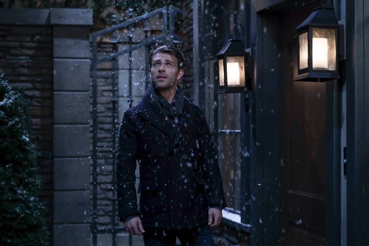 Evan Hofer as Dex Heller in 'General Hospital' looking up at falling snow