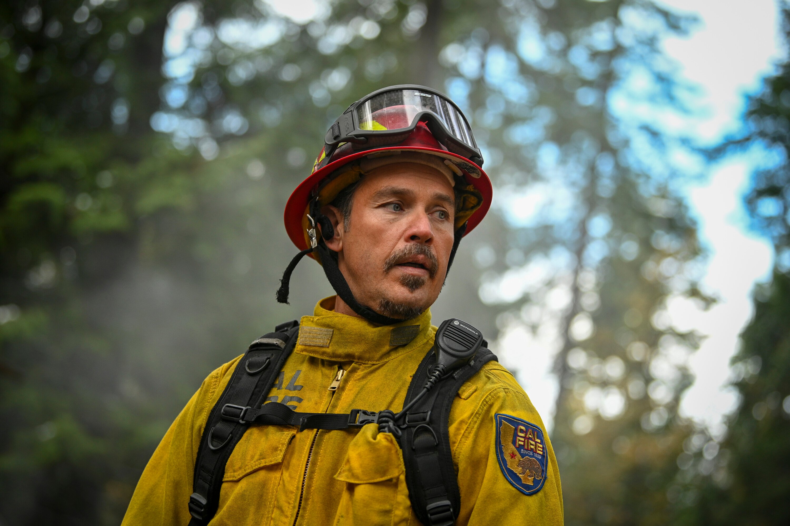 Kevin Alejandro dressed as a firefighter in the CBS drama 'Fire Country'