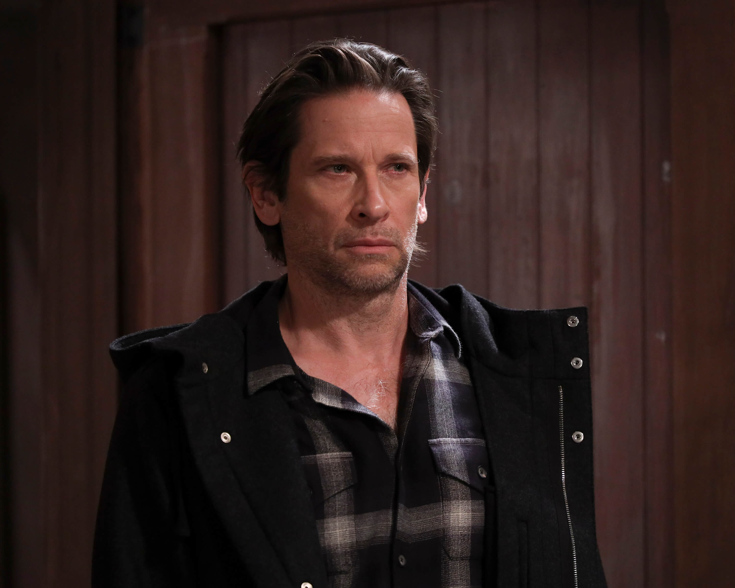 'General Hospital' star Roger Howarth dressed in a plaid shirt and black jacket; in a scene from the soap opera.