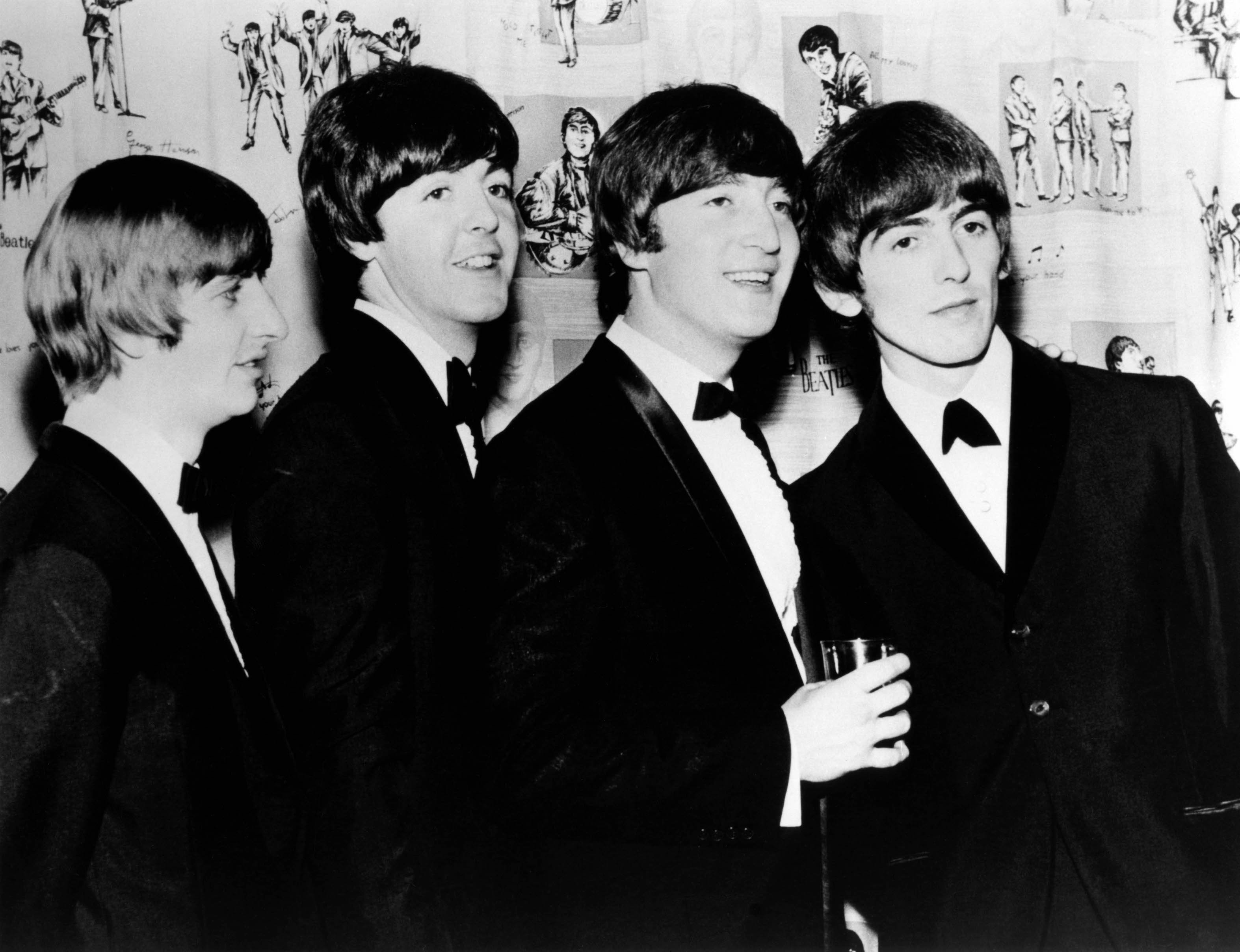 Ringo Starr, Paul McCartney, John Lennon, and George Harrison attend the premiere of The Beatles