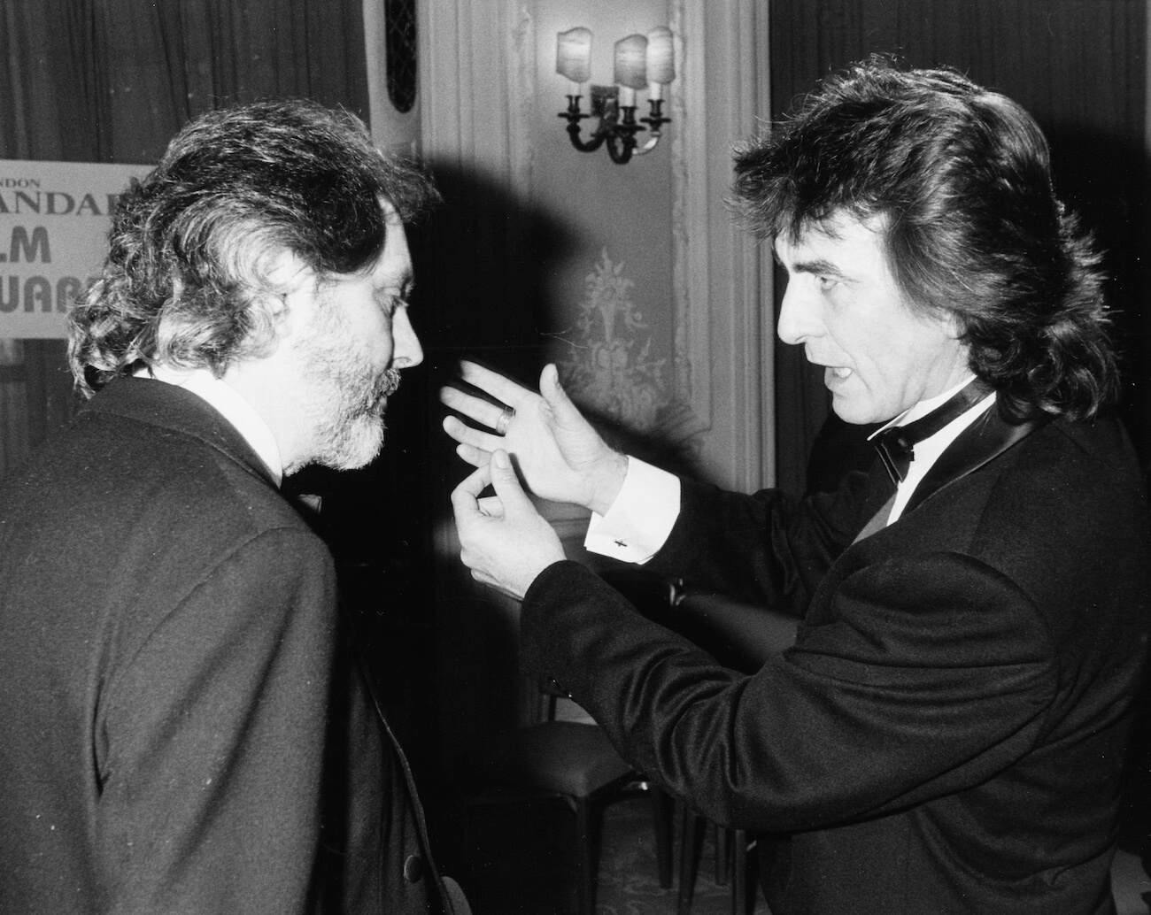 George Harrison talking to director David Puttnam in 1986.