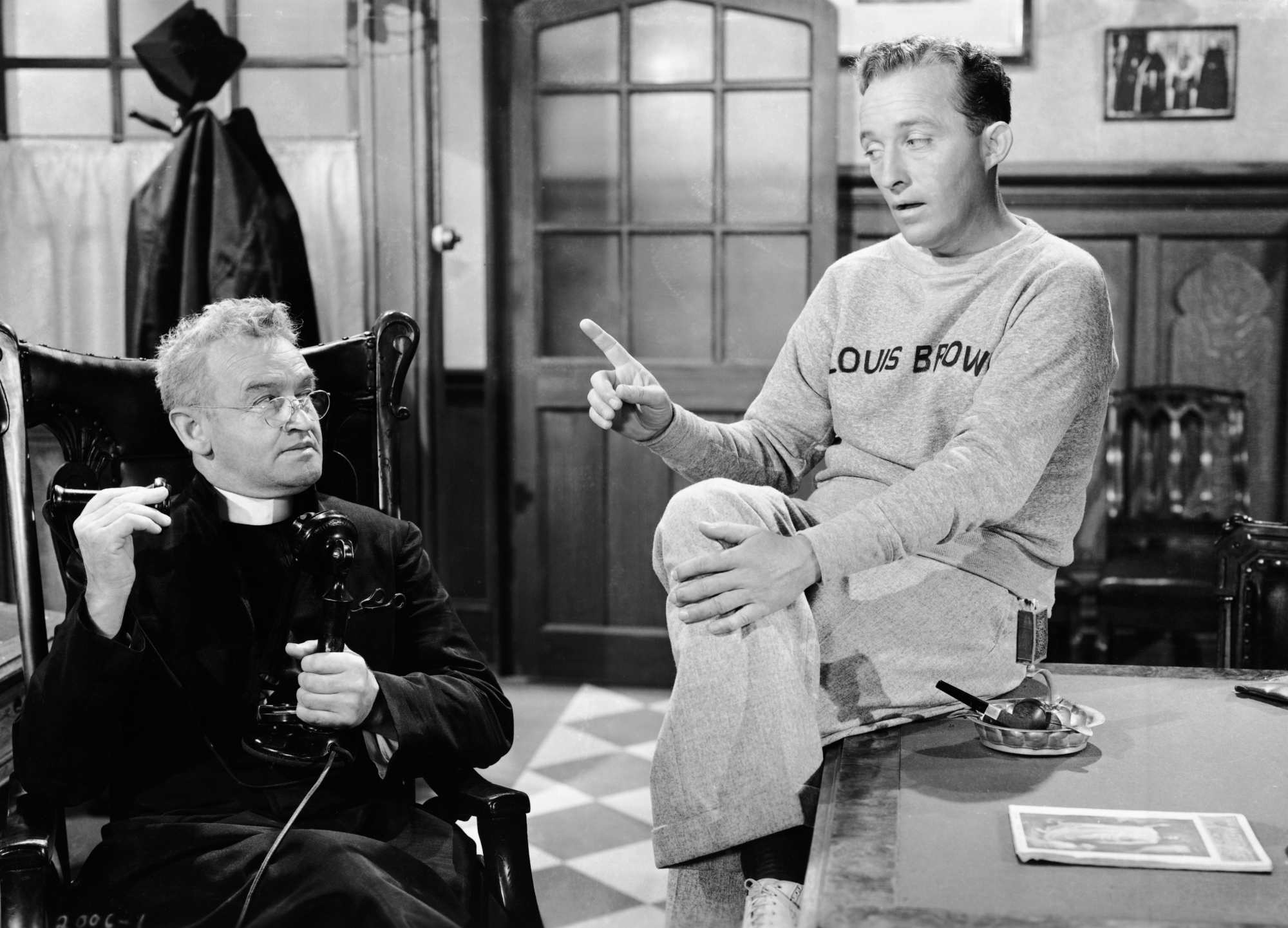 'Going My Way' Barry Fitzgerald as Father Fitzgibbon and Bing Crosby as Father Chuck O'Malley. O'Malley is holding his finger out toward Fitzgibbon.