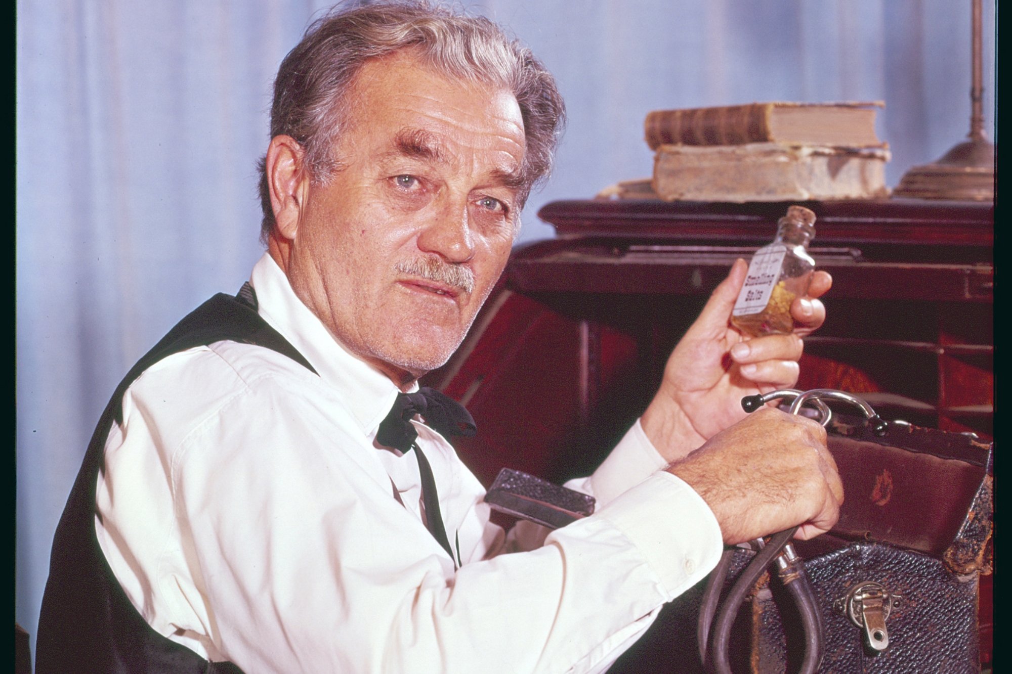'Gunsmoke' Milburn Stone as Doc Adams holding a bottle of medicine