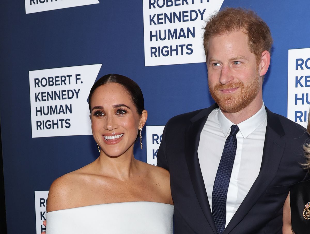Meghan, Duchess of Sussex and Prince Harry, Duke of Sussex pose for photos as a charity event hosted by the Kennedy Center.