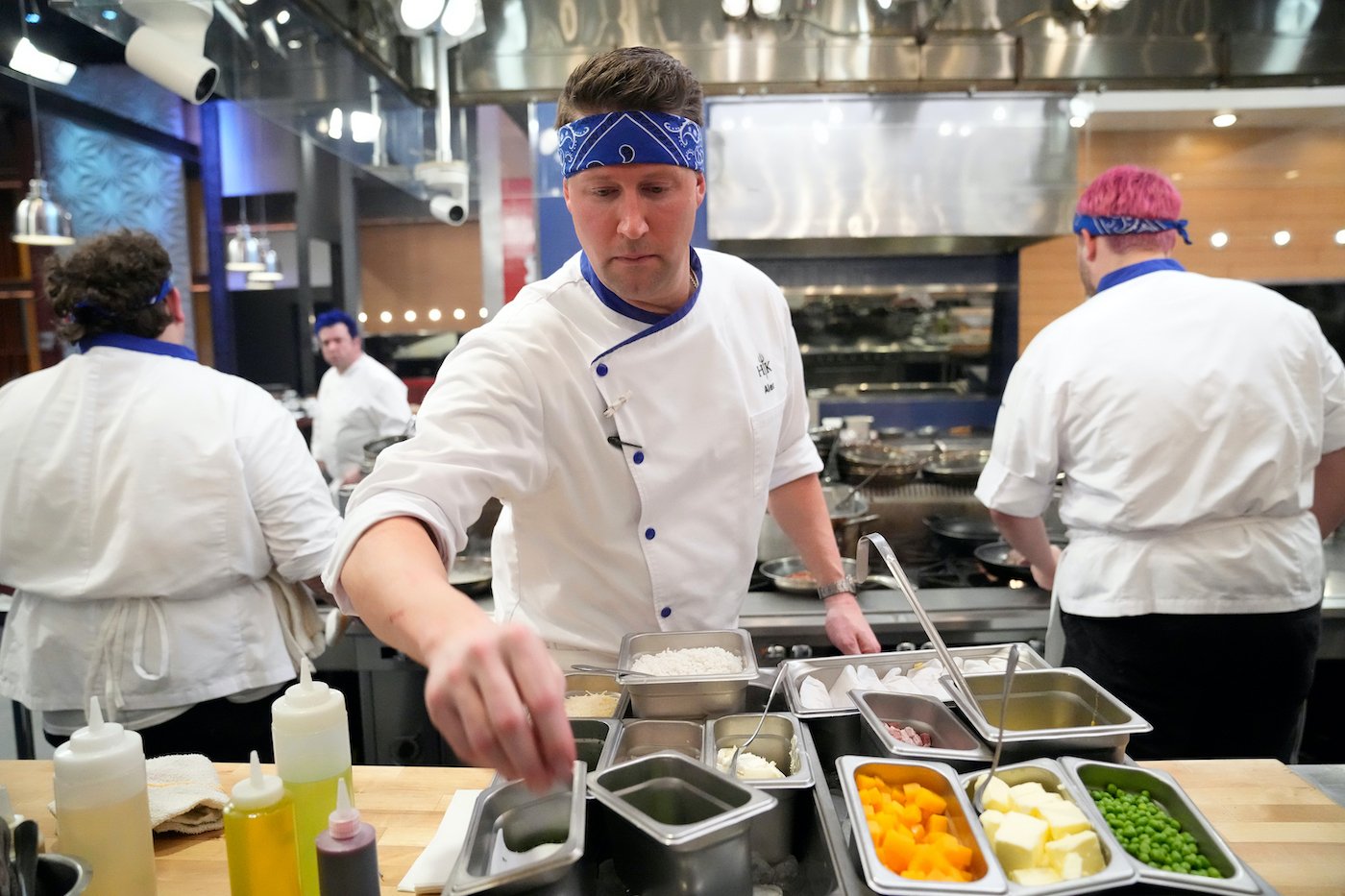 'Hell's Kitchen: Battle of the Ages' winner Alex Belew working in the kitchen 