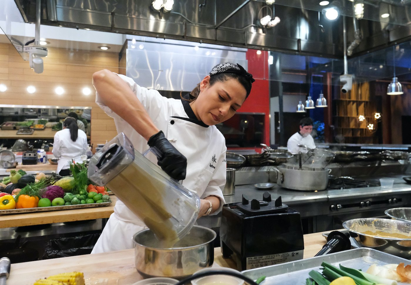 Chef Dafne Mejia from 'Hell's Kitchen: Battle of the Ages' pours liquid from a blender into a pot