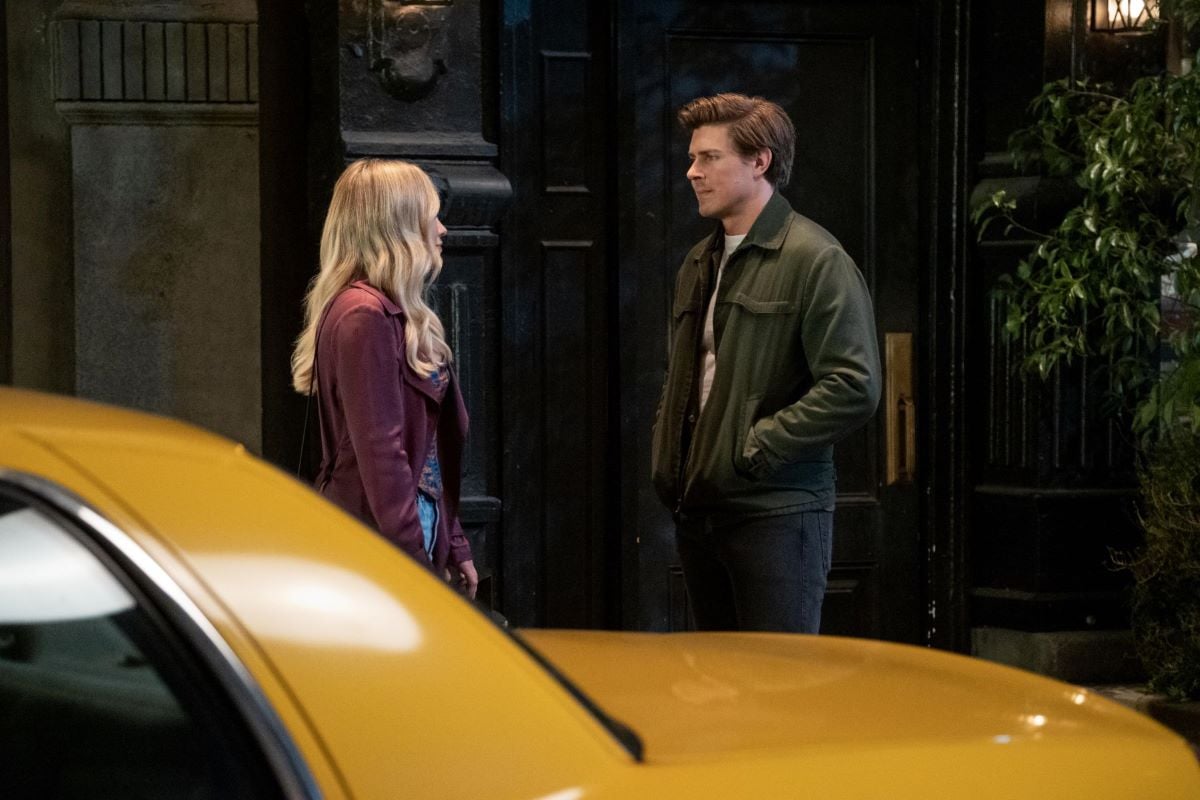 Hilary Duff as Sophie and Chris Lowell as Jesse in 'How I Met Your Father,' which Hulu hasn't renewed or canceled yet. Sophie wears a magenta coat and jeans. Jesse wears a dark green jacket over a white shirt and jeans.