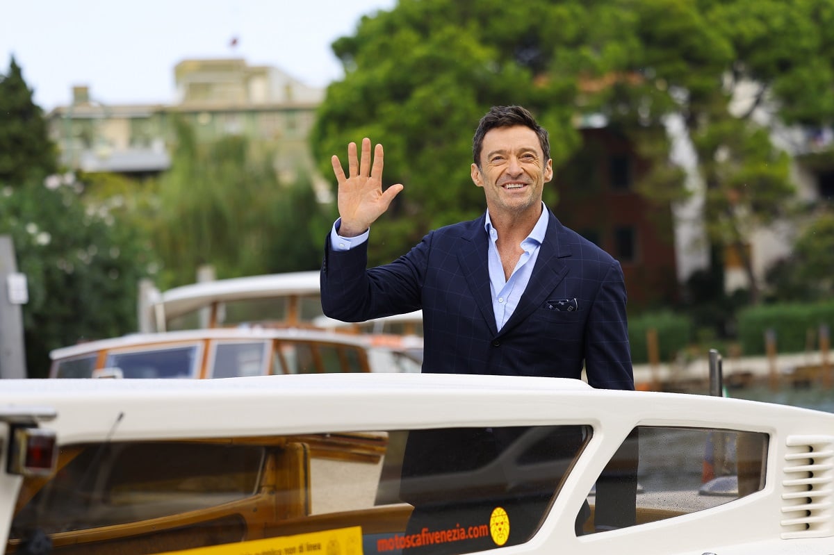 'X-Men' actor Hugh Jackman waving from a boat as he arrives at the Venice International Film Festival.