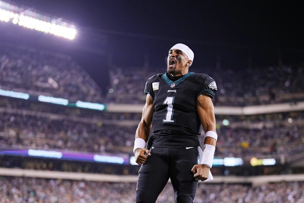 Jalen Hurts wearing a black Philadelphia Eagle's uniform stands in the end zone at Lincoln Financial Field in November 2022
