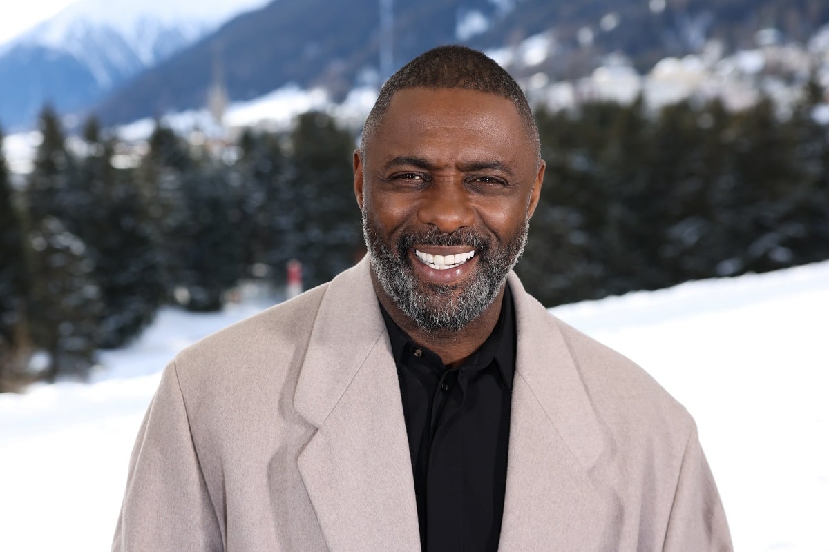 Idris Elba taking a picture after an interview.