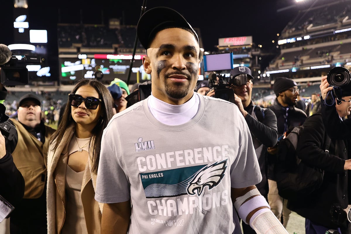 Jalen Hurts and his girlfriend Bryonna Burrows hold hands as the leave the stadium