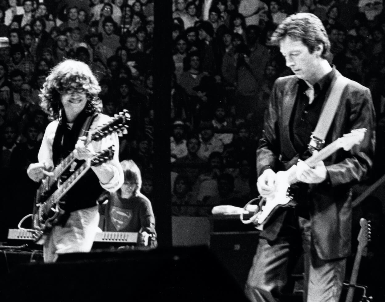 Jimmy Page (left) of Led Zeppelin and Eric Clapton perform at Action Research into Multiple Sclerosis benefit concert on December 9, 1983.