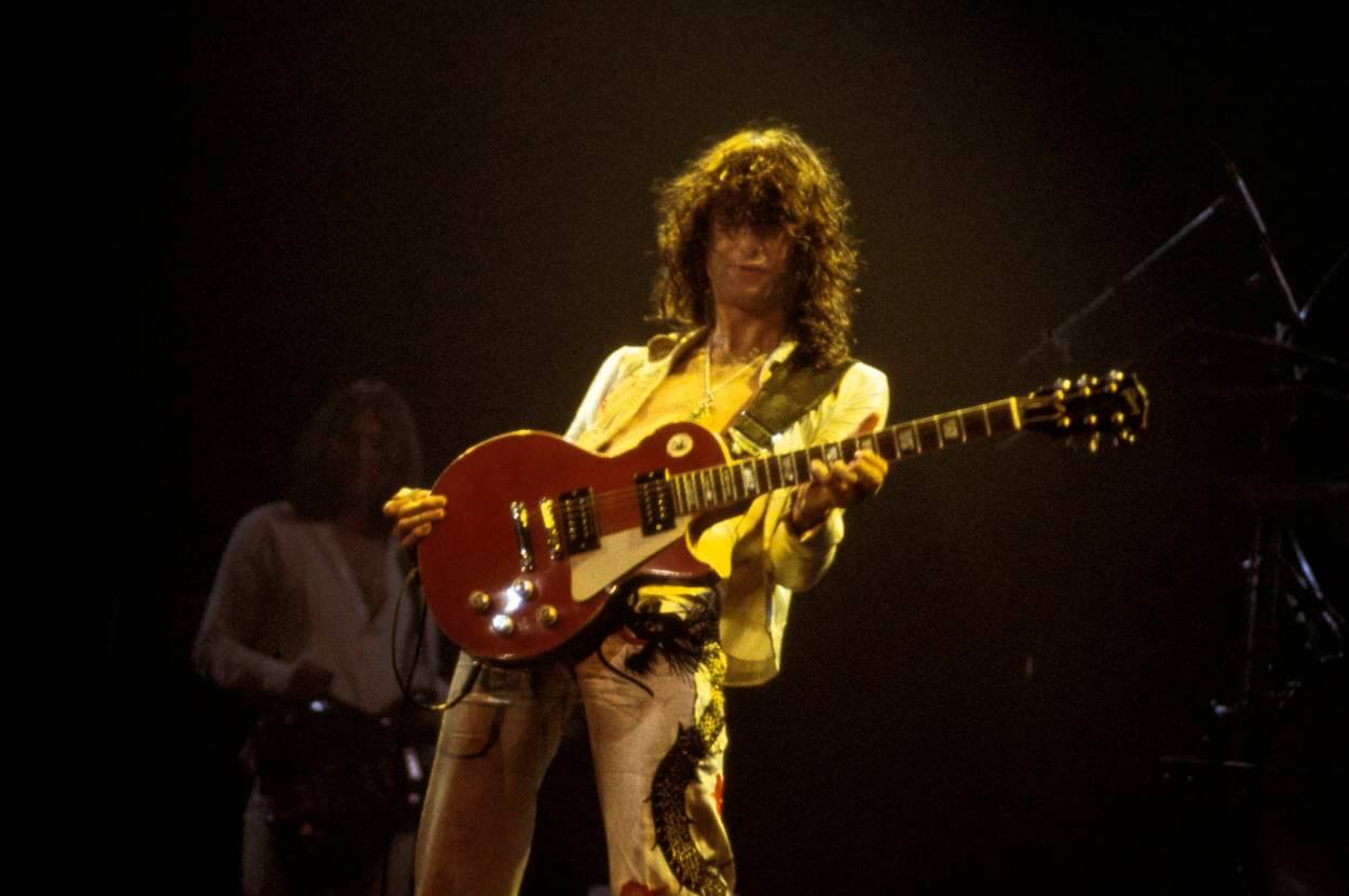 Jimmy Page plays his red Gibson Les Paul guitar during a 1977 Led Zeppelin concert in New York City.