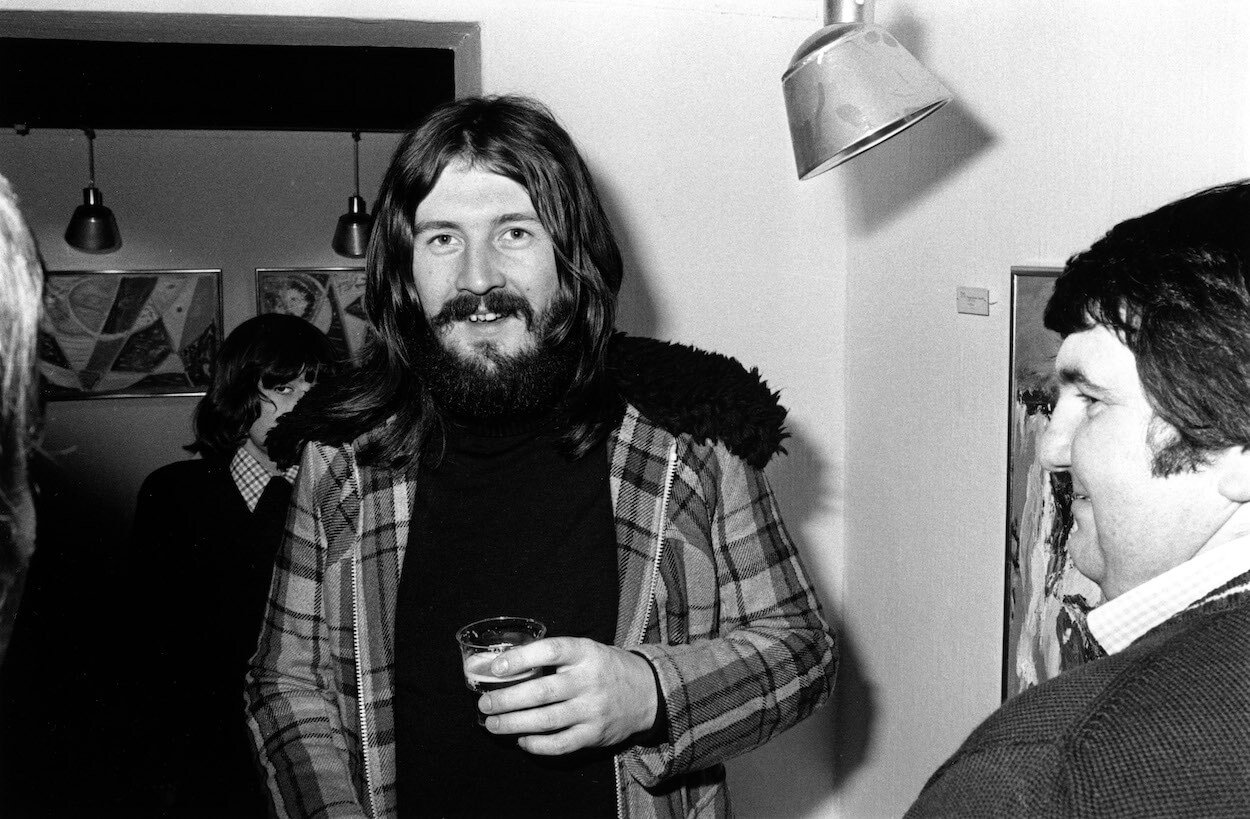 Led Zeppelin drummer John Bonham holds a drink during a reception at an art gallery in Denmark in 1973.