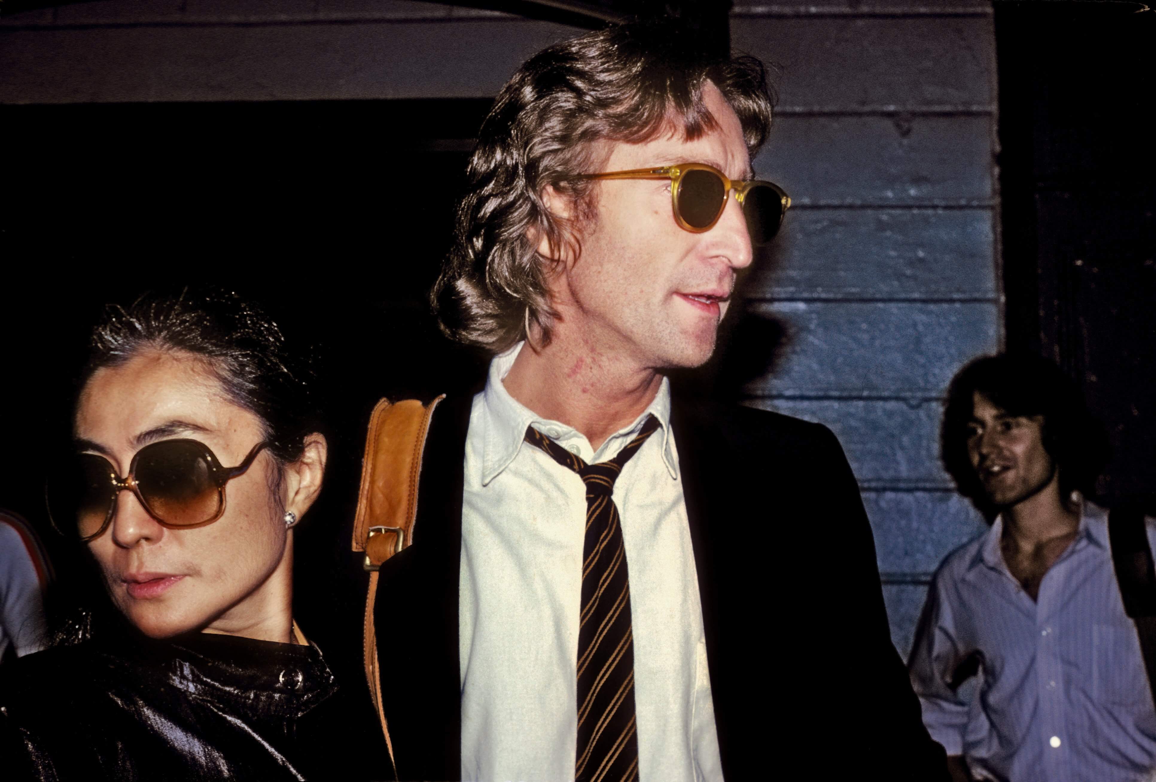 Former Beatle John Lennon and his wife Yoko Ono outside of the Times Square recording studio 'The Hit Factory' before a recording session of his final album 'Double Fanasy'