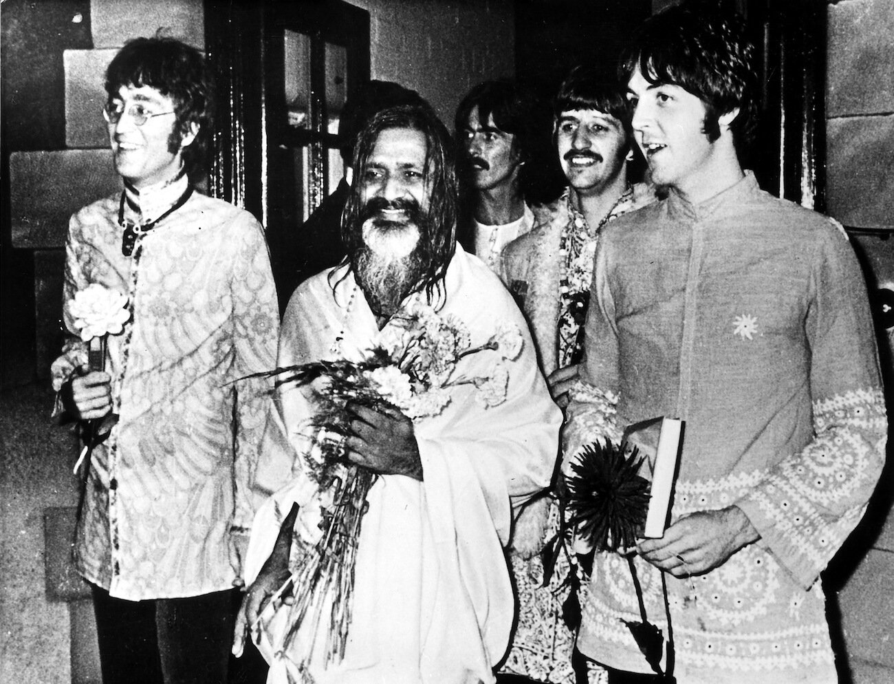 John Lennon, George Harrison, Ringo Starr, Paul McCartney and Maharishi Mahesh Yogi in 1967.