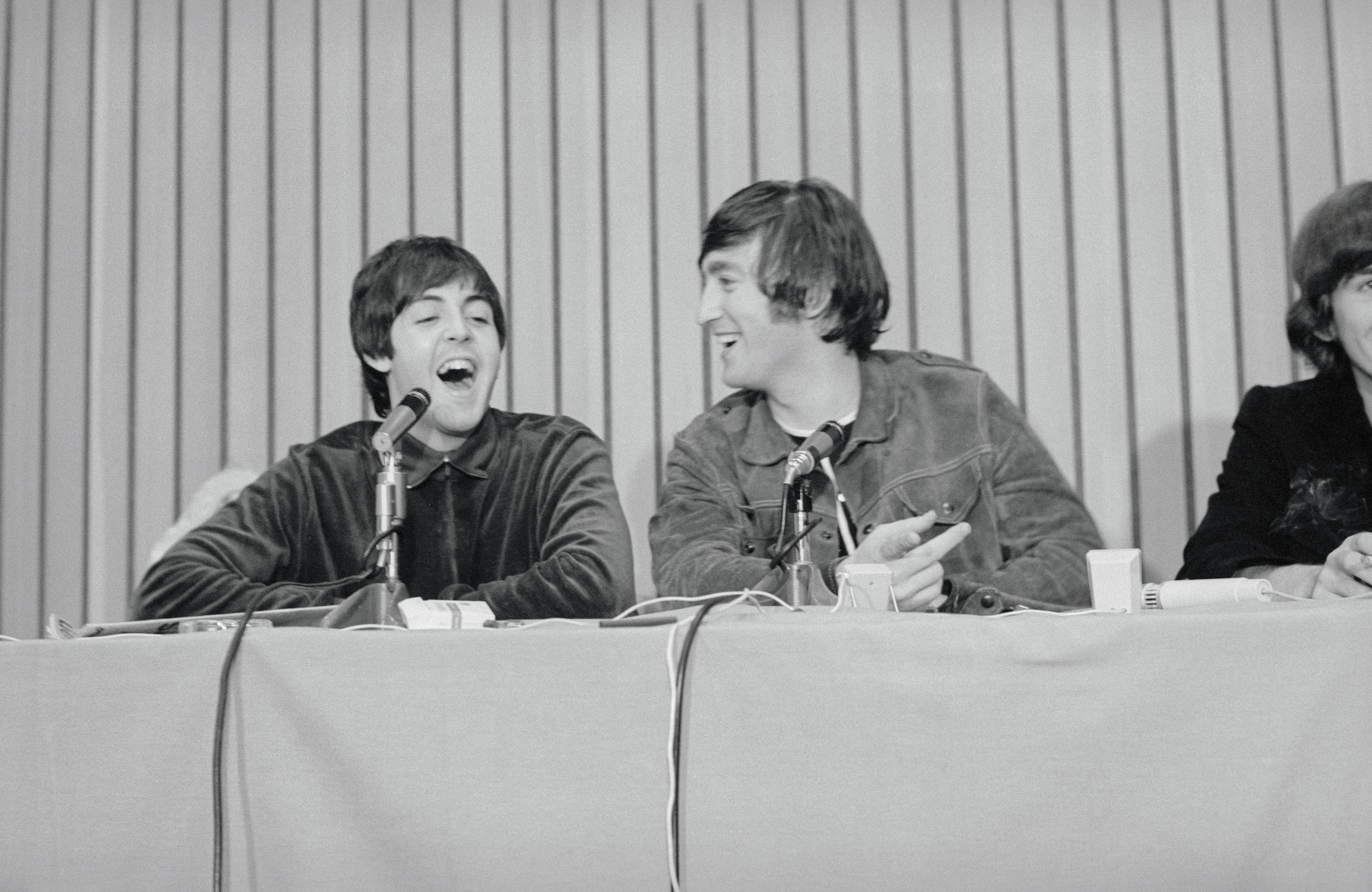 Paul McCartney and John Lennon at a press conference after The Beatles performance in Portland