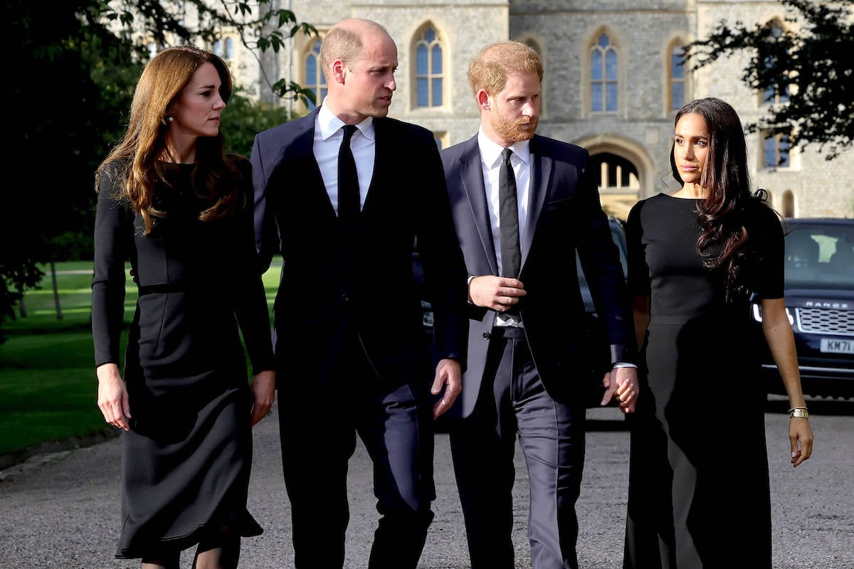 Meghan Markle, who, according to 'Spare,' told Prince William to 'kindly take your finger out of my face,' walks with Kate Middleton, Prince William, and Prince Harry 