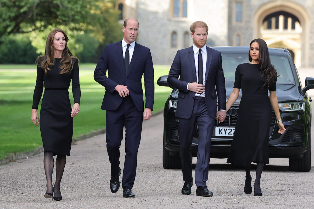 Prince Harry, who claimed in 'Spare' the 'trouble' began with an assistant, walks with Kate Middleton, Prince William, and Meghan Markle