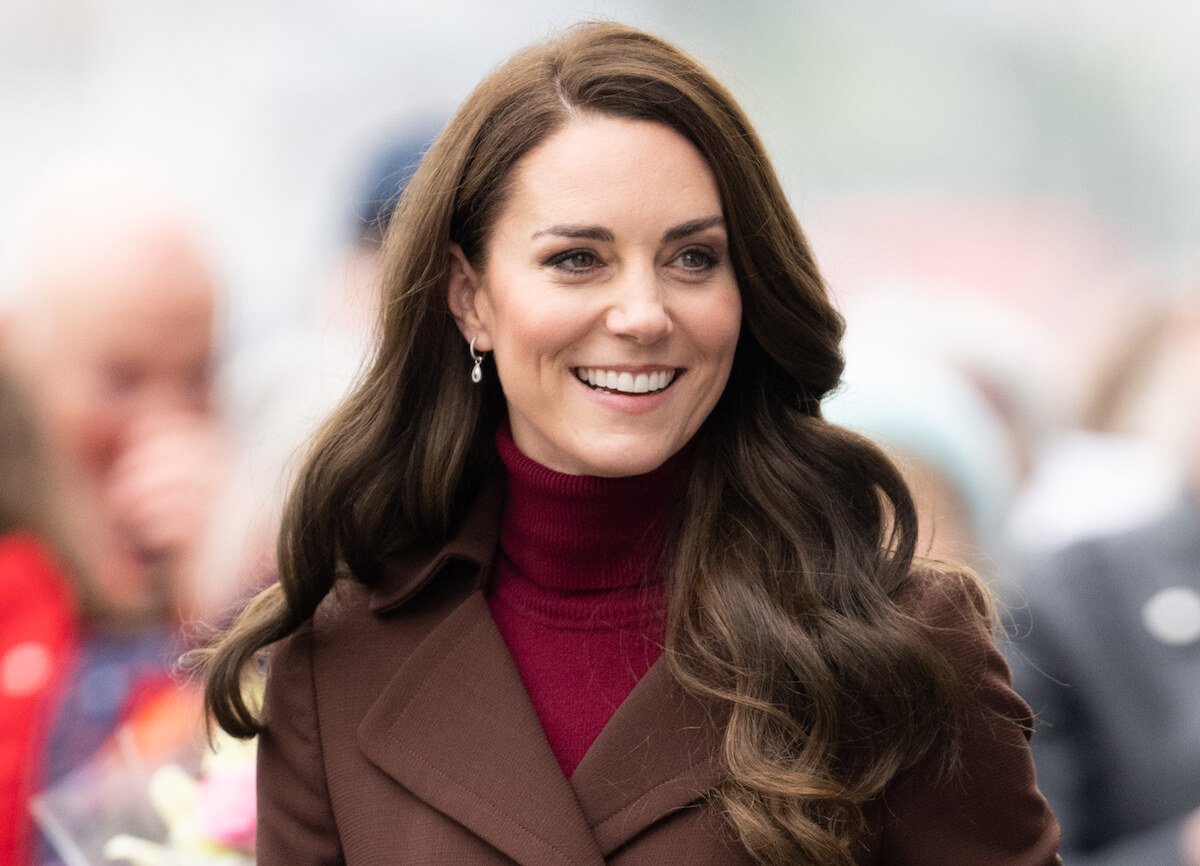 Kate Middleton, Princess of Wales, smiles during a public engagement.