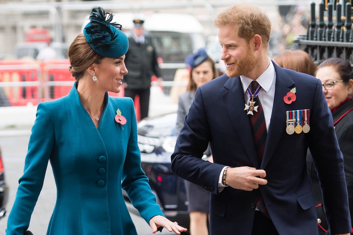 Prince Harry, who 'copies' Kate Middleton's body language in a WellChild video, stands with Kate Middleton