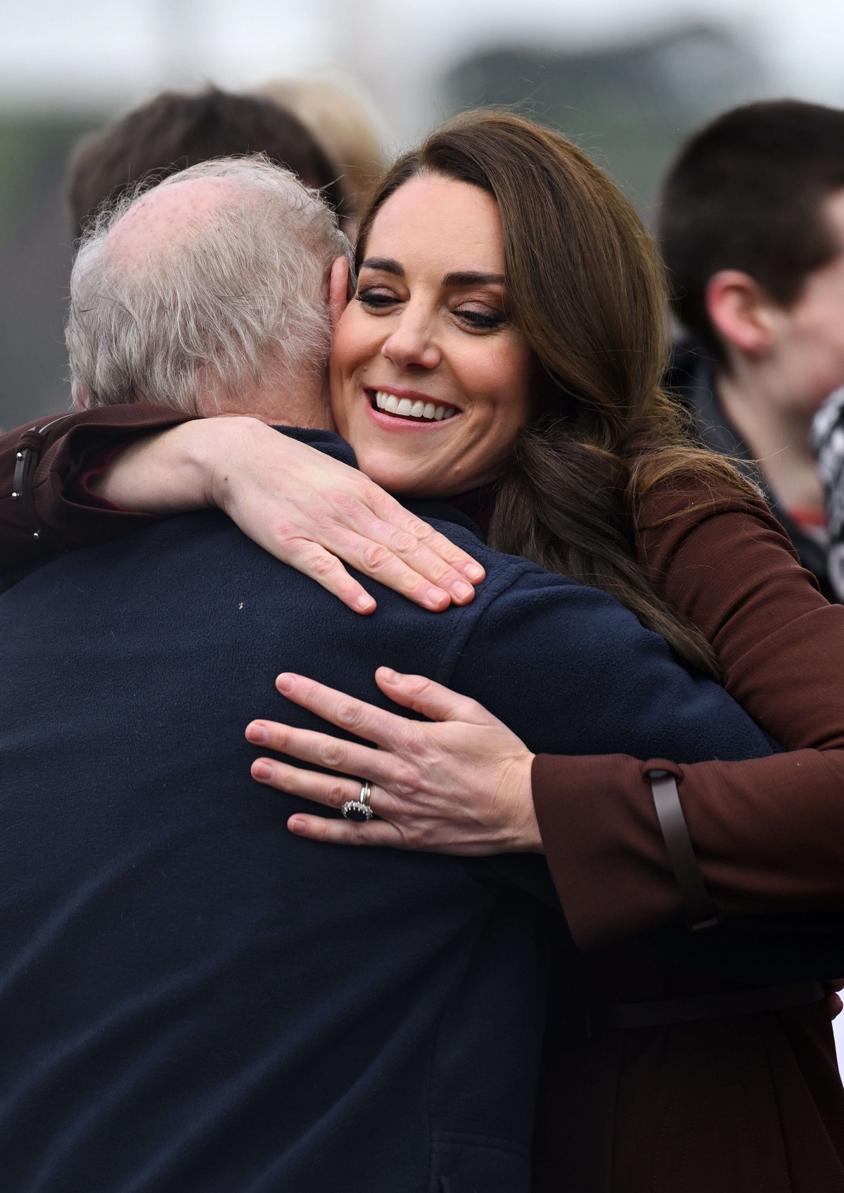 Kate Middleton hugs her former school teacher, Jim Embury, during a visit to the National Maritime Museum Cornwall