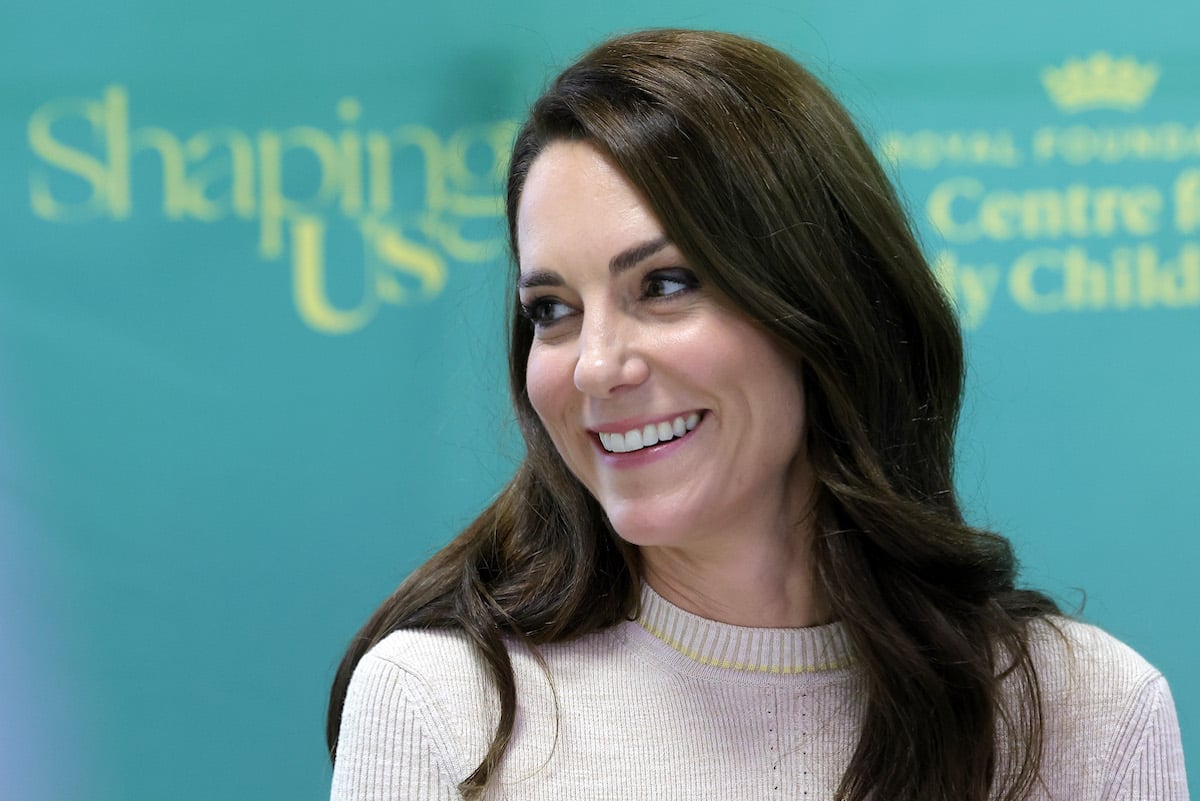 Kate Middleton, who debuted a new Instagram, smiles and looks on at a Shaping Us event