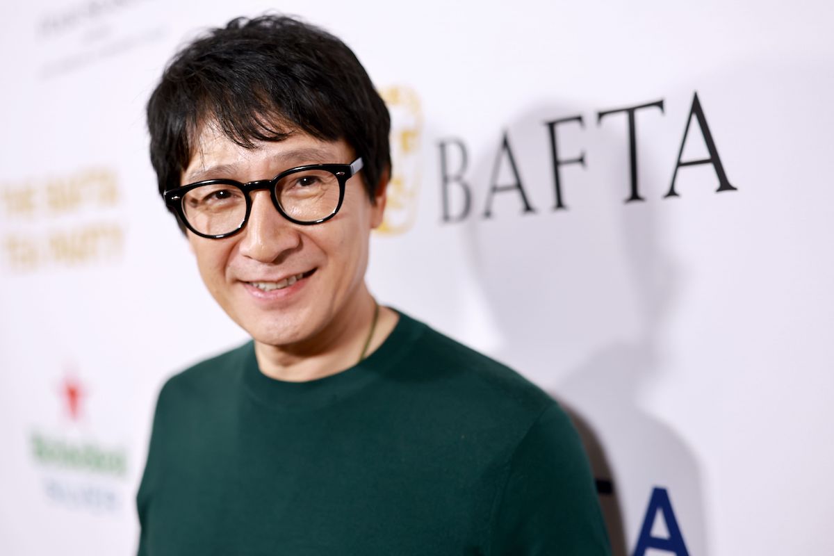 Ke Huy Quan attends The BAFTA Tea Party in a green sweater