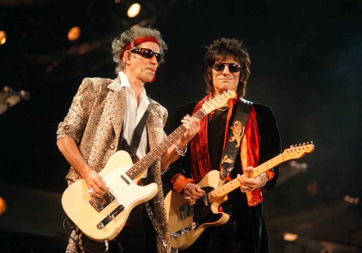 Rolling Stones guitarists Keith Richards (left) and Ronnie Wood perform during a 1998 concert in Germany.