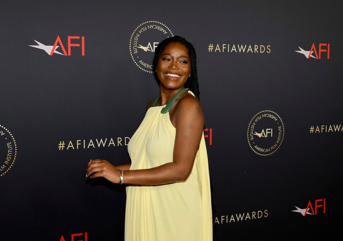 Keke Palmer poses in front of a black backdrop