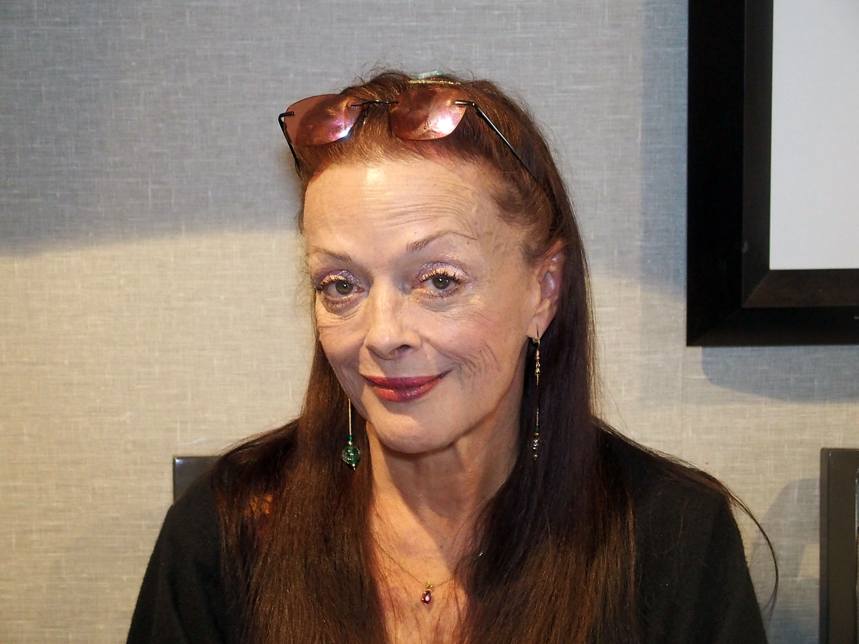 'The Addams Family' and 'As the World Turns' star Lisa Loring smiling for a photo during a convention.
