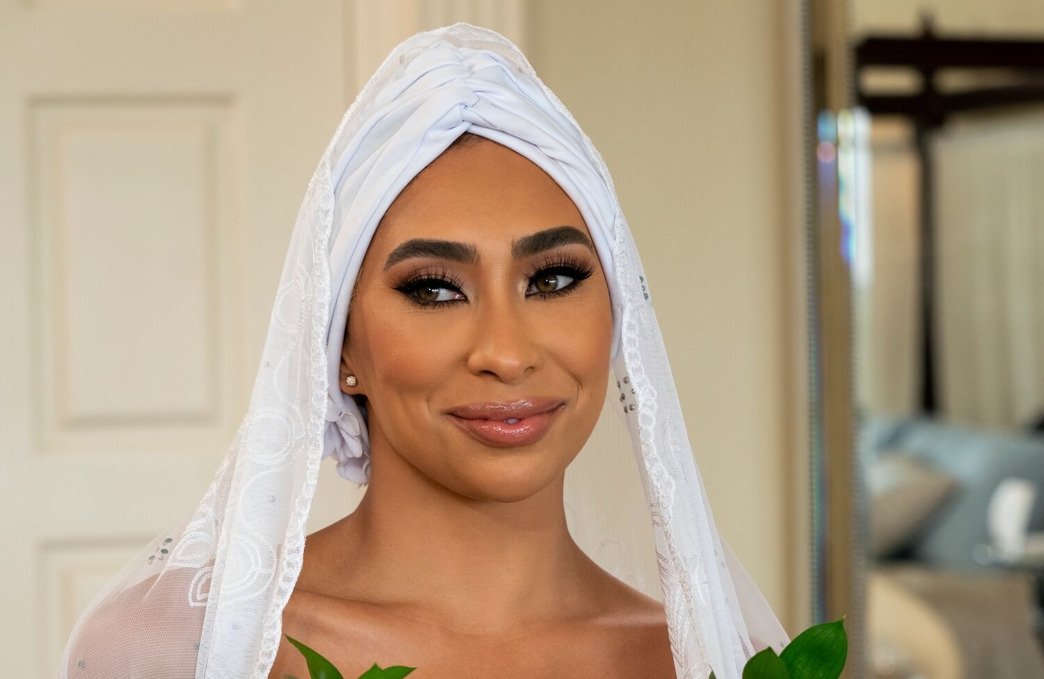 'Love Is Blind' star Raven reveals new details regarding SK's cheating. Raven is seen here in a wedding veil.