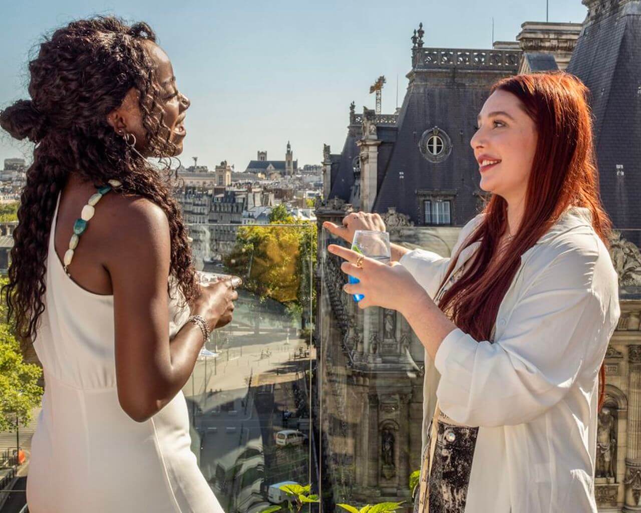 Gessica and Caroline Renner talk while holding drinks on 'Love Trip: Paris'.