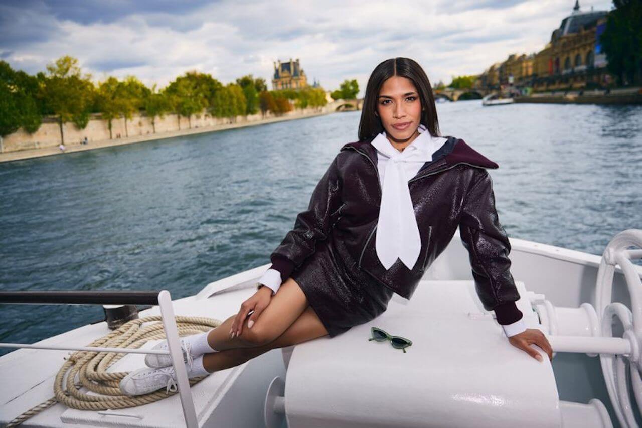 Josielyn Aguilera poses on the front of a boat on 'Love Trip: Paris'.