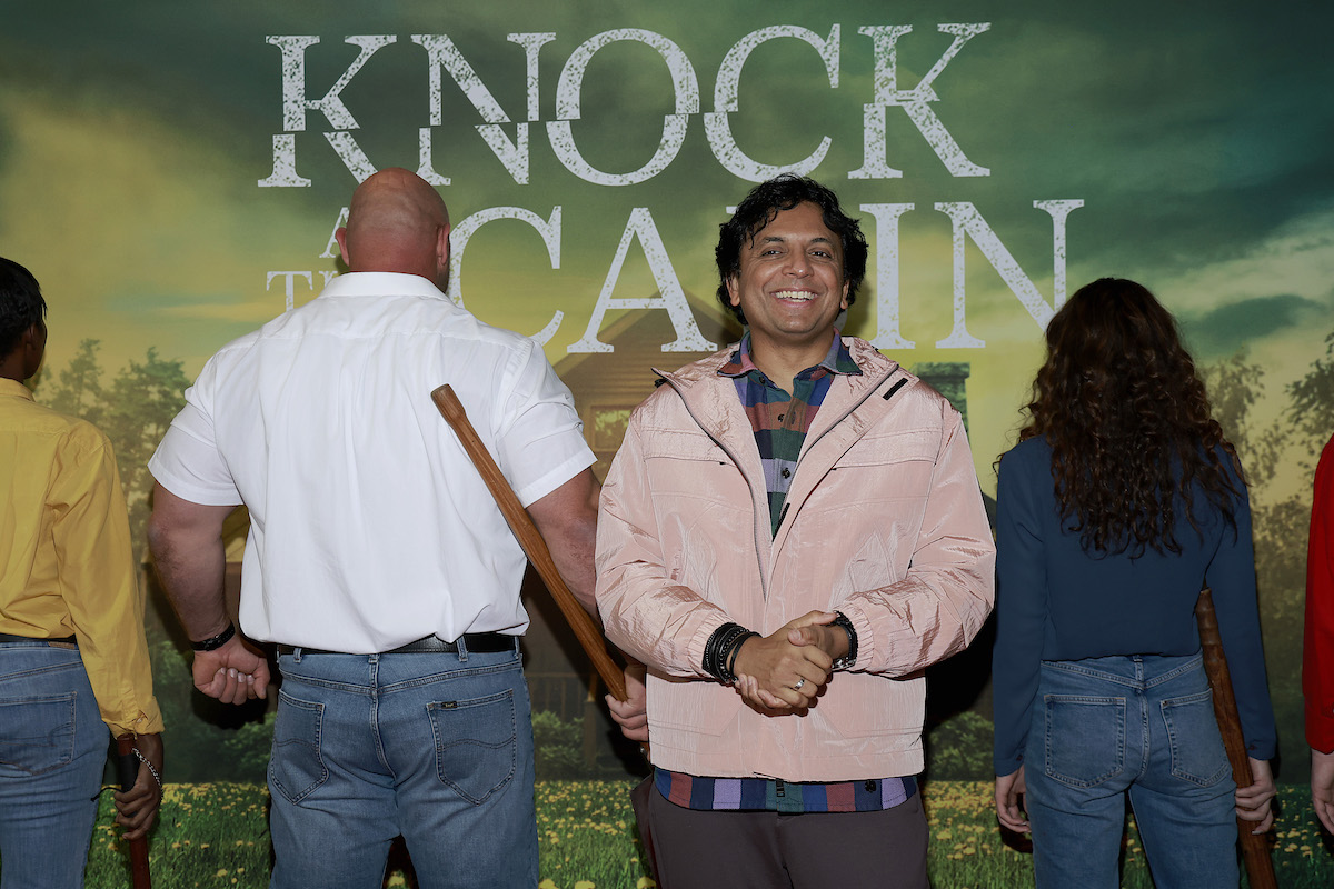 M. Night Shyamalan poses at a screening for "Knock At The Cabin"