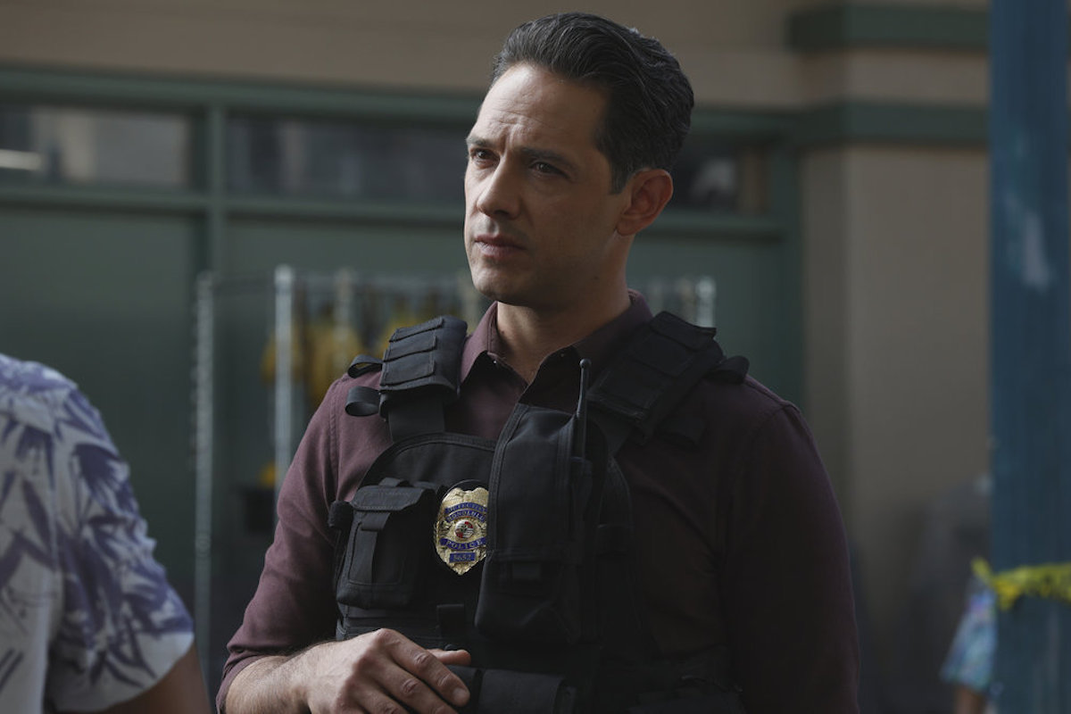 Michael Rady as Det. Chris Childs, wearing a bulletproof vest, in the 'Magnum P.I.' Season 5 premiere