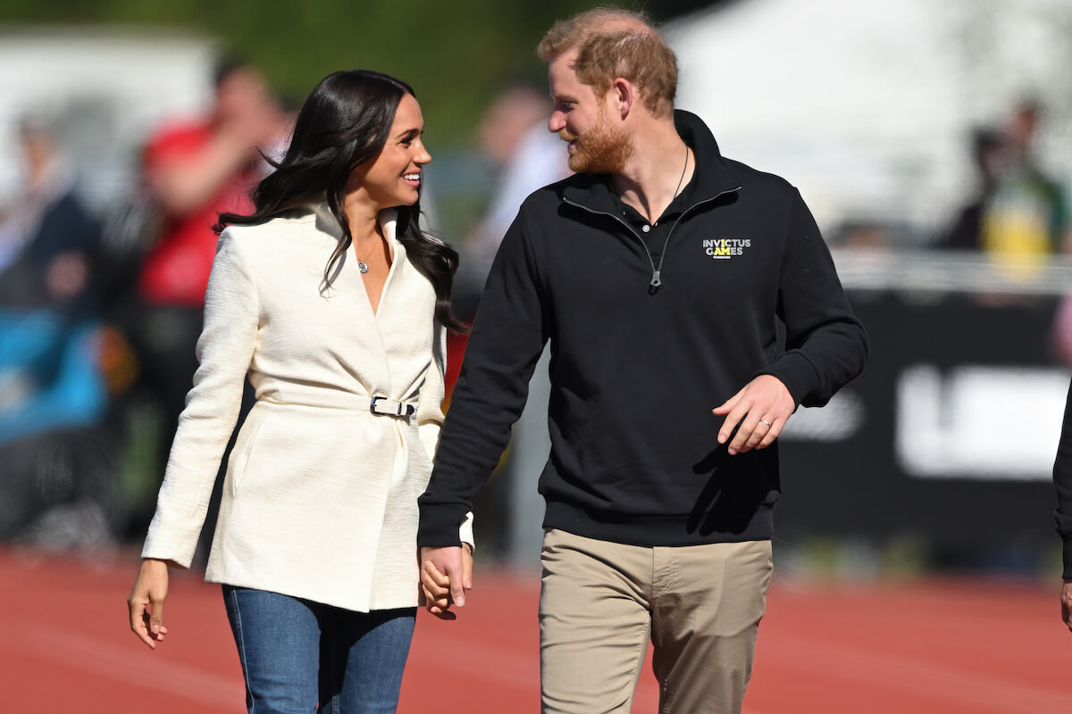 Meghan Markle, who Prince Harry recalled seeing on Instagram in 'Spare', walks with Prince Harry