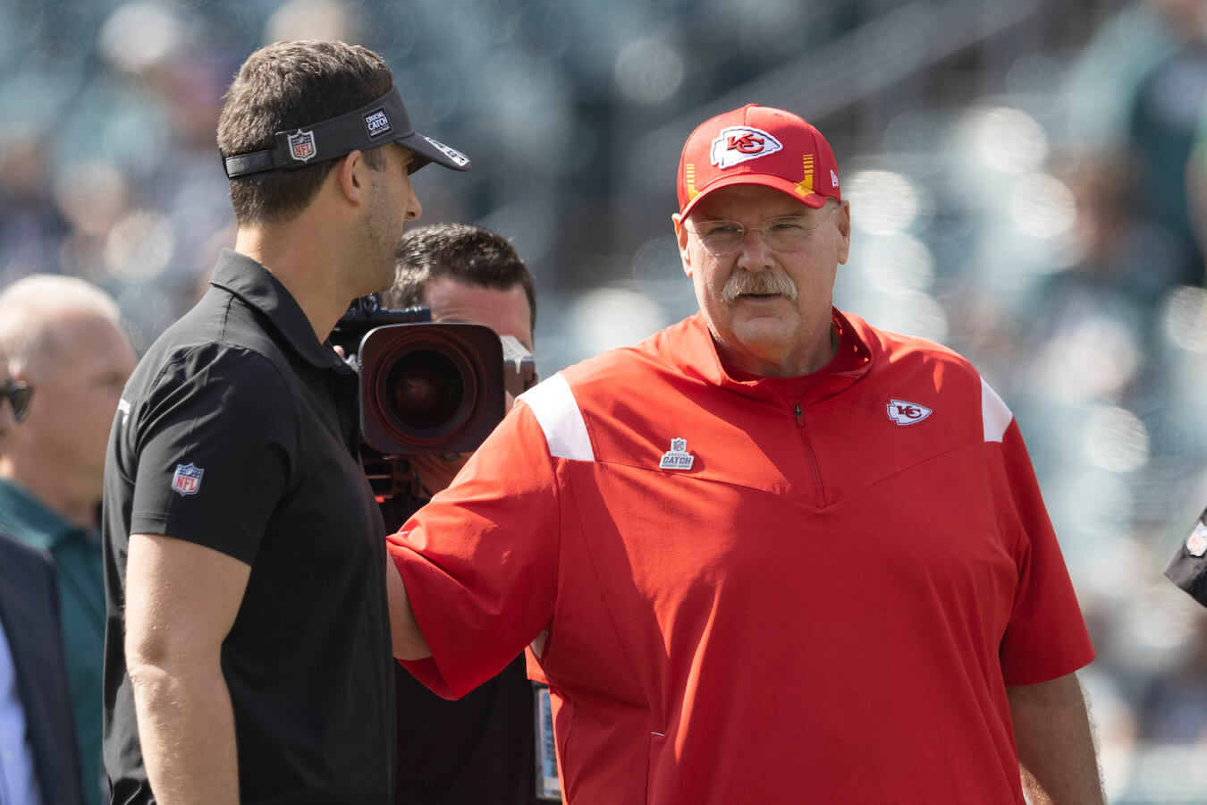 Philadelphia Eagles coaches Nick Sirianni and Andy Reid talking to each other on the field