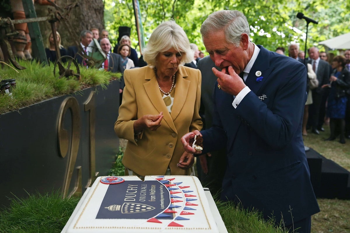 Now-King Charles and Camilla Parker Bowles cut a cake to celebrate the 21st anniversary of Duchy originals products