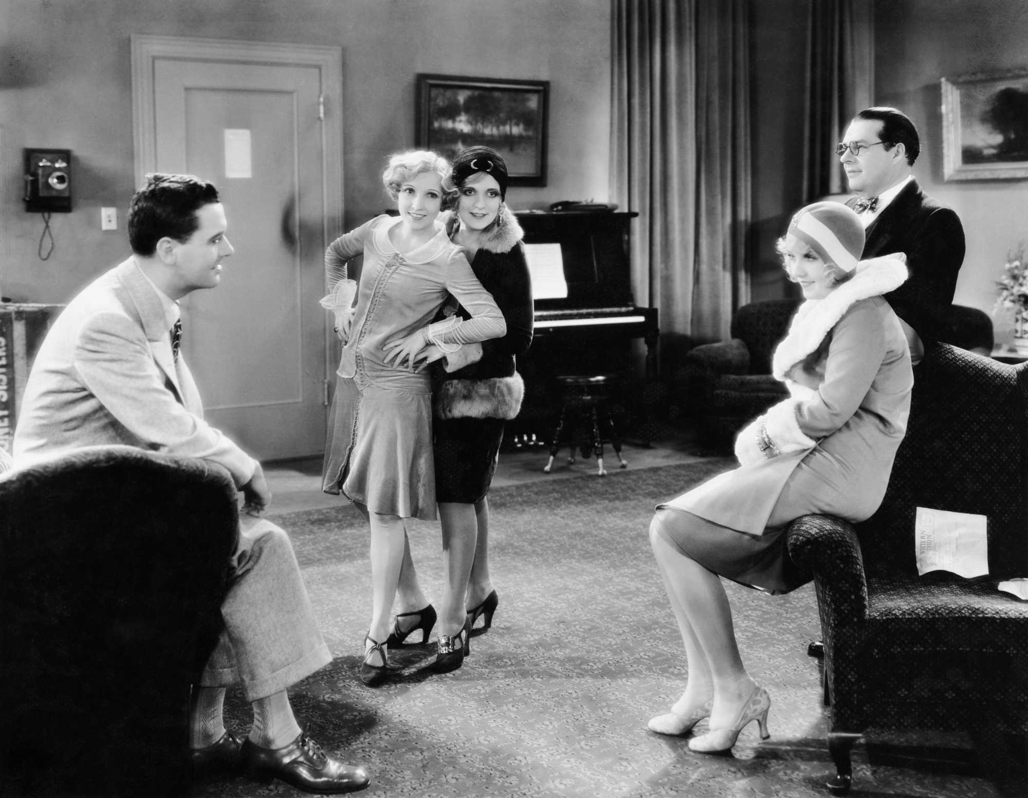 Oscar Best Picture winner ‘The Broadway Melody’ Charles King as Eddie Kearns, Bessie Love as Harriet ‘Hank’ Mahoney, Mary Doran as Flo, Anita Page as Queen Mahoney, and Nacio Herb Brown as Pianist dancing in a black-and-white picture