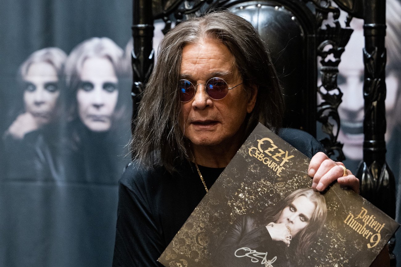 Ozzy Osbourne signing copies of his new album, 'Patient Number 9' in 2022.