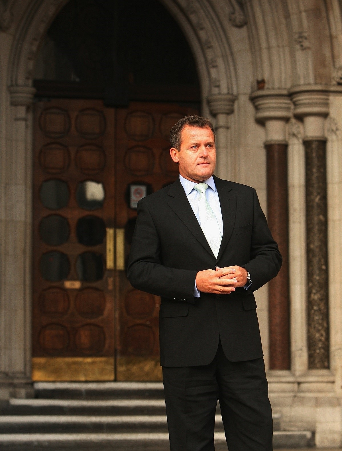 Paul Burrell, the former butler of Princess Diana, poses for the press outside the High Court in London