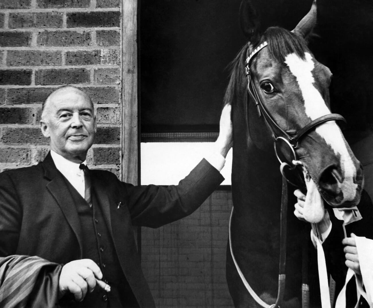 Paul McCartney's father with a horse in 1964.