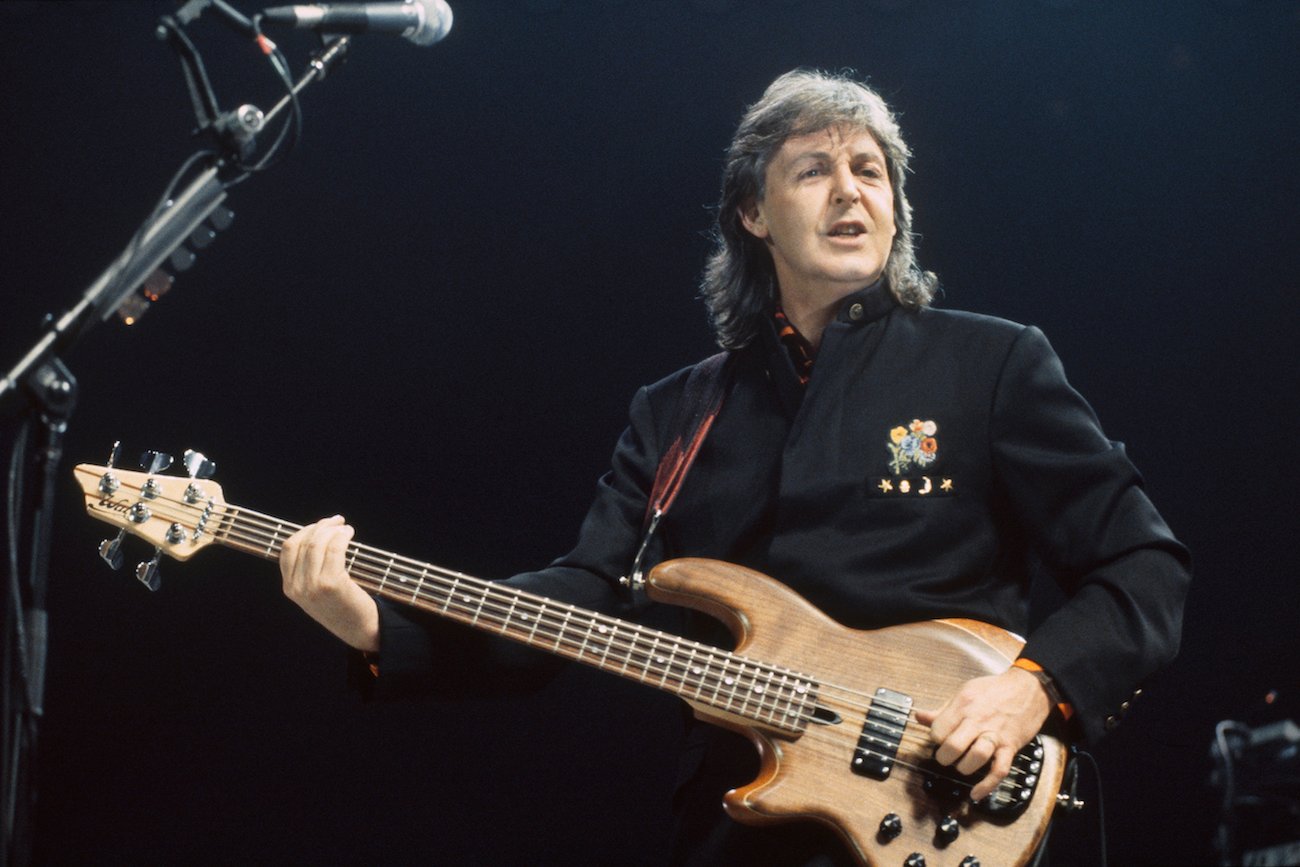 Paul McCartney performing in black in 1996.