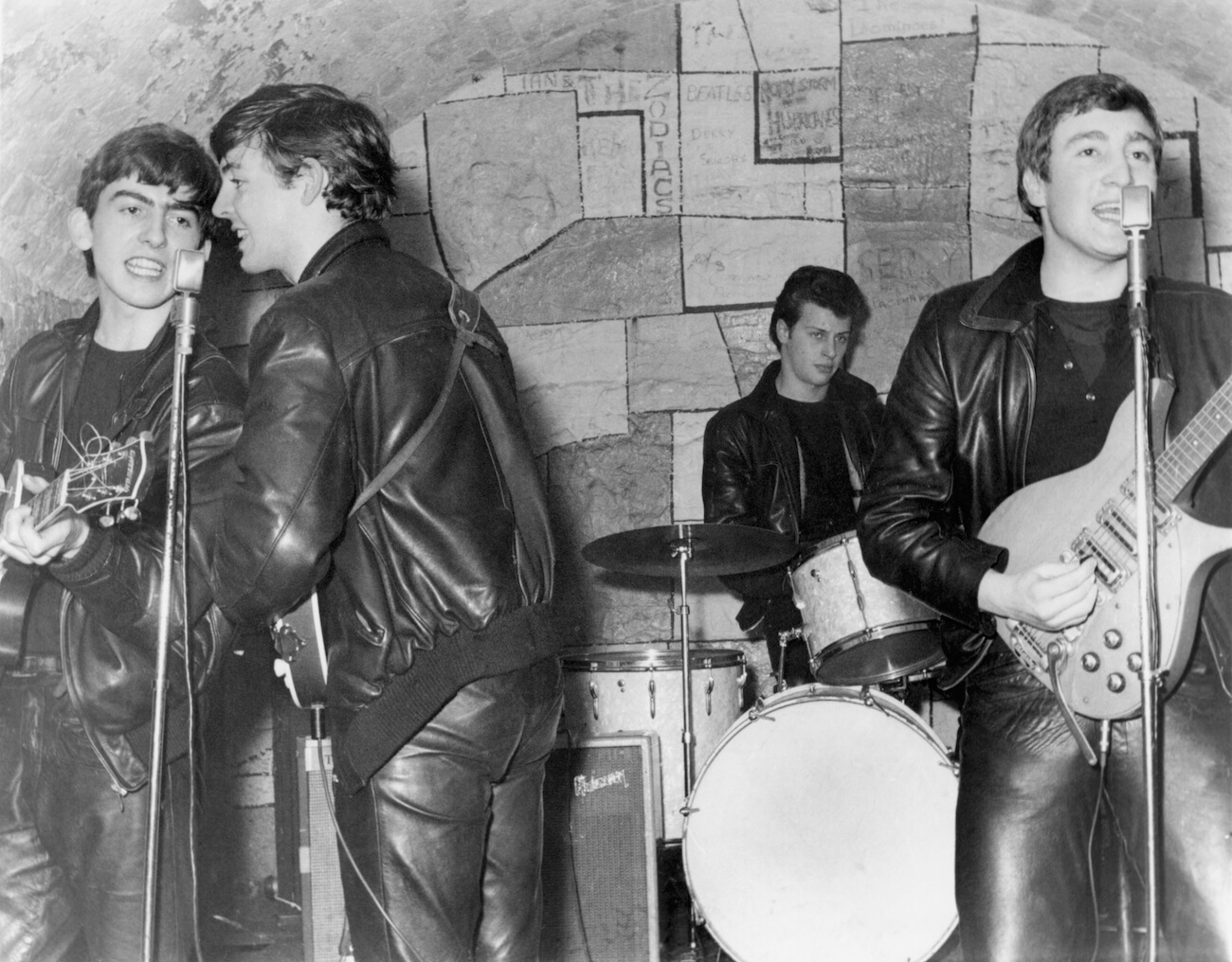Paul McCartney, John Lennon, George Harrison performing at The Cavern Club in 1961.