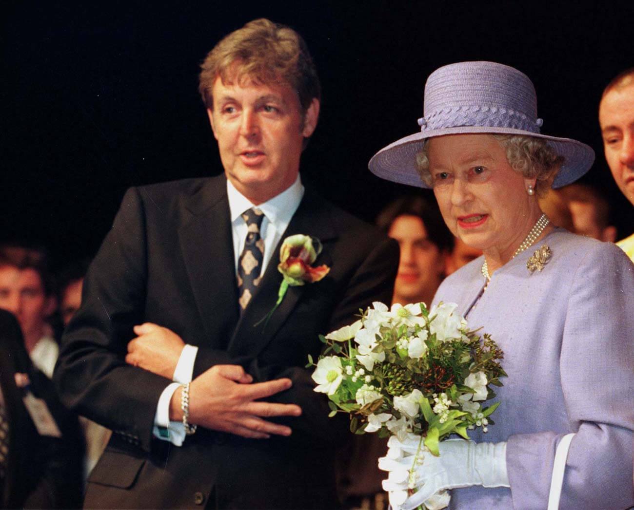 Paul McCartney and Queen Elizabeth II at the Liverpool Institute for Performing Arts in 1996.