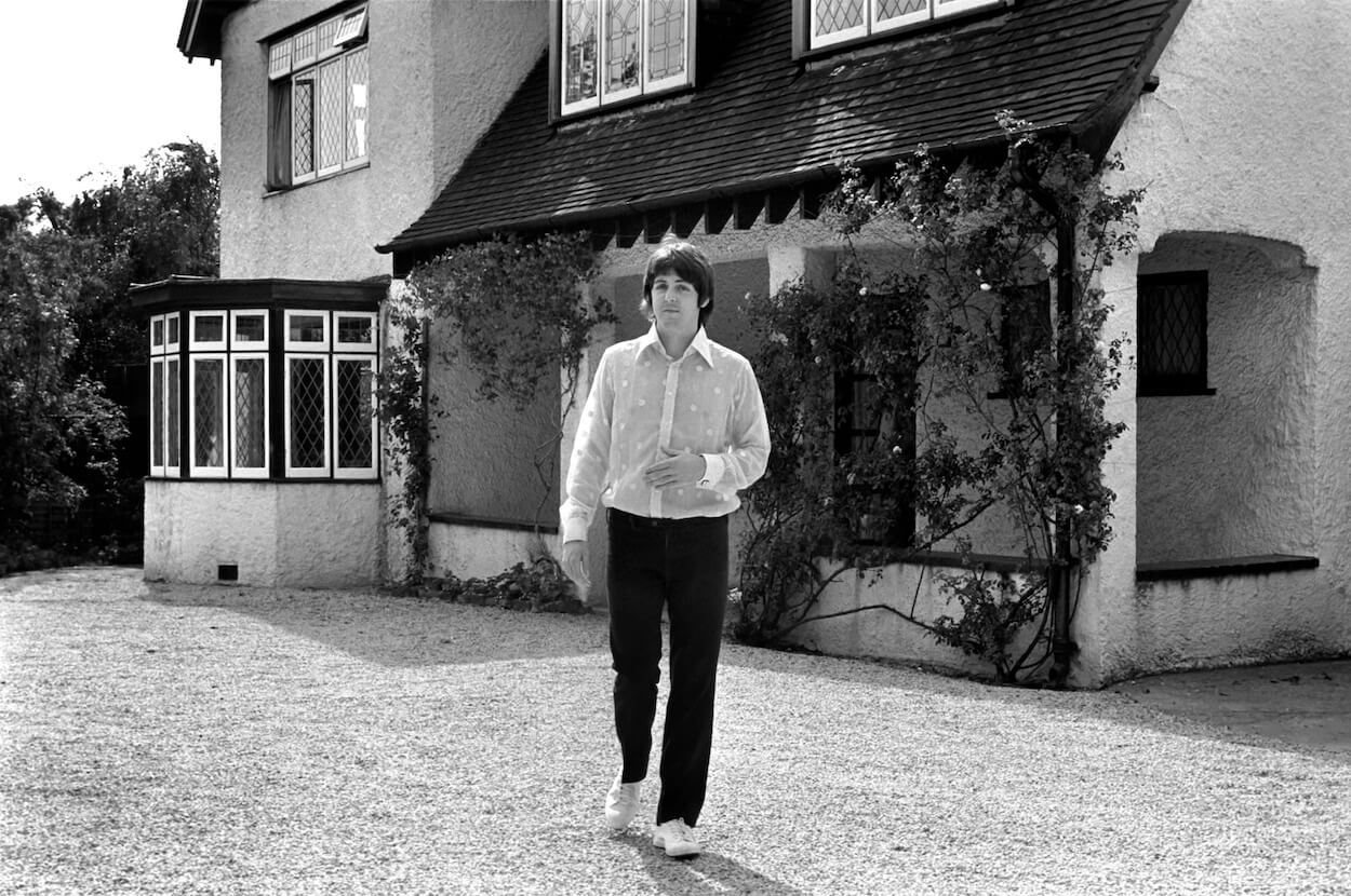 Paul McCartney of The Beatles walks around the grounds of his father's home in England in 1968.